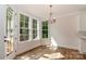 Sunlit breakfast nook features a stylish light fixture and outdoor views at 4271 Candlewood Dr, Sherrills Ford, NC 28673