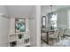 Elegant dining room with a chandelier and seating for eight adjacent to a mudroom with shelves at 4271 Candlewood Dr, Sherrills Ford, NC 28673