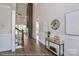 Stylish entryway with hardwood floors, decorative table, and stairway leading to upper level living spaces at 4271 Candlewood Dr, Sherrills Ford, NC 28673