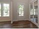Bright foyer featuring hardwood floors, a glass-paneled front door, and glass french doors leading to an office at 4271 Candlewood Dr, Sherrills Ford, NC 28673