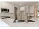 Bright kitchen featuring stainless appliances, white cabinets, quartz countertops, subway tiles, and hardwood floors at 4271 Candlewood Dr, Sherrills Ford, NC 28673