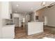 Open-concept kitchen with modern appliances, white cabinets, and a large island at 4271 Candlewood Dr, Sherrills Ford, NC 28673