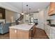 Well-lit kitchen boasts a spacious island with seating, modern appliances, and hardwood flooring at 4271 Candlewood Dr, Sherrills Ford, NC 28673