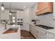 Close up of a modern kitchen featuring stainless appliances, white cabinets, and hardwood floors at 4271 Candlewood Dr, Sherrills Ford, NC 28673