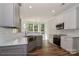Modern kitchen featuring stainless appliances, light grey cabinets, a subway tile backsplash, and hardwood floors at 4271 Candlewood Dr, Sherrills Ford, NC 28673