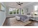 Inviting main bedroom with tray ceiling, lots of natural light, and hardwood floors at 4271 Candlewood Dr, Sherrills Ford, NC 28673