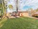 Brick home with a large backyard and patio at 7101 Ridgebrook Dr, Charlotte, NC 28210