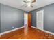 Spacious bedroom with hardwood floors and gray walls at 7101 Ridgebrook Dr, Charlotte, NC 28210