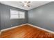 Bedroom with hardwood floors and gray walls at 7101 Ridgebrook Dr, Charlotte, NC 28210
