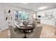 Bright dining area with large window and wood table at 7101 Ridgebrook Dr, Charlotte, NC 28210