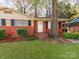 Brick ranch home with mature tree and carport at 7101 Ridgebrook Dr, Charlotte, NC 28210