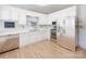 Modern white kitchen with stainless steel appliances at 7101 Ridgebrook Dr, Charlotte, NC 28210
