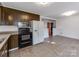View of kitchen with appliances and access to dining area at 7101 Ridgebrook Dr, Charlotte, NC 28210