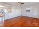 Hardwood floors and neutral walls in this spacious living room at 7101 Ridgebrook Dr, Charlotte, NC 28210