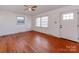 Living room featuring hardwood floors, a window, and exterior door at 7101 Ridgebrook Dr, Charlotte, NC 28210