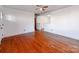 Living room with hardwood floors and access to other rooms at 7101 Ridgebrook Dr, Charlotte, NC 28210