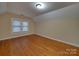 Bright bedroom featuring hardwood floors and two windows at 126 E Division Ave, Salisbury, NC 28144