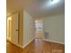 Hardwood floor bedroom with access to another room and bathroom at 126 E Division Ave, Salisbury, NC 28144