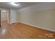 Spacious bedroom with hardwood floors and access to hallway at 126 E Division Ave, Salisbury, NC 28144