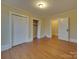 Bedroom with hardwood floors, closet, and access to another room at 126 E Division Ave, Salisbury, NC 28144