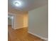 Hardwood floor bedroom with access to another room at 126 E Division Ave, Salisbury, NC 28144