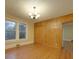 Dining room with wood paneled walls and chandelier at 126 E Division Ave, Salisbury, NC 28144