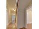 Long hallway with wooden floors and staircase at 126 E Division Ave, Salisbury, NC 28144