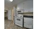 White kitchen with appliances, double sink, and tile floor at 126 E Division Ave, Salisbury, NC 28144