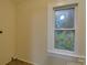 Laundry room with tile floor and window at 126 E Division Ave, Salisbury, NC 28144