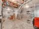 Unfinished basement with exposed insulation and concrete flooring, offering potential for customization at 14700 Old Vermillion Dr, Huntersville, NC 28078