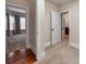Hallway showing hardwood floors leading into carpeted rooms, with views of the bathroom and bedroom at 14700 Old Vermillion Dr, Huntersville, NC 28078