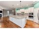 Open kitchen boasts an island, stainless appliances, and a seamless flow into the adjacent living space at 14700 Old Vermillion Dr, Huntersville, NC 28078