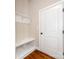 Mudroom featuring built-in bench with shelving and an exterior door at 14700 Old Vermillion Dr, Huntersville, NC 28078