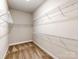 Spacious walk-in closet provides ample storage and organization with wire shelving throughout at 14700 Old Vermillion Dr, Huntersville, NC 28078