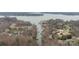 Aerial view of waterfront homes with docks and boat slips along a calm waterway at 5752 Natoma Rd, Lake Wylie, SC 29710