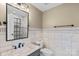 Bathroom with marble tile and modern vanity at 5752 Natoma Rd, Lake Wylie, SC 29710