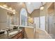 Large bathroom with double vanity, soaking tub, and walk-in shower at 5752 Natoma Rd, Lake Wylie, SC 29710