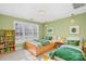 Bright bedroom featuring twin beds, white shutters and playful green accents at 5752 Natoma Rd, Lake Wylie, SC 29710
