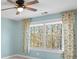 Bedroom with large window and wood blinds at 5752 Natoma Rd, Lake Wylie, SC 29710