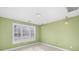 Light green bedroom with window and two pendant lights at 5752 Natoma Rd, Lake Wylie, SC 29710
