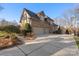 Brick home featuring a three-car garage and a large driveway at 5752 Natoma Rd, Lake Wylie, SC 29710