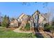 Two story home with brick and stucco exterior and landscaping at 5752 Natoma Rd, Lake Wylie, SC 29710
