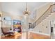 Living area with hardwood floors, fireplace, and large windows at 5752 Natoma Rd, Lake Wylie, SC 29710