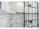 Shower with marble tile and black frame at 5752 Natoma Rd, Lake Wylie, SC 29710