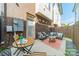 Outdoor patio featuring comfortable seating, string lights, and a privacy fence at 947 Warren Burgess Ln, Charlotte, NC 28205