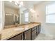 Bathroom vanity featuring double sinks, granite countertop, and modern fixtures at 947 Warren Burgess Ln, Charlotte, NC 28205