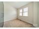 Bedroom features carpet, closet, and natural light from windows at 947 Warren Burgess Ln, Charlotte, NC 28205