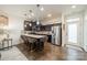 Modern kitchen featuring stainless steel appliances, granite countertops, and a spacious island at 947 Warren Burgess Ln, Charlotte, NC 28205