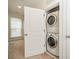 Convenient laundry closet with stacked washer and dryer at 947 Warren Burgess Ln, Charlotte, NC 28205