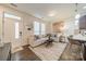 Inviting living room with modern decor, plush seating, and natural light with hardwood floors at 947 Warren Burgess Ln, Charlotte, NC 28205